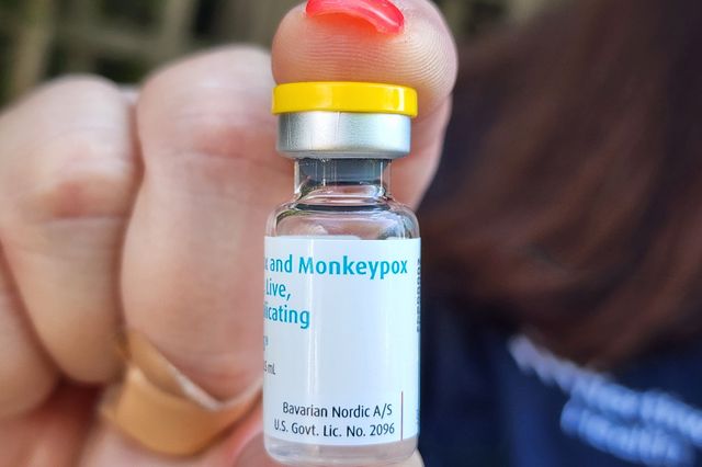 A health staffer holds up monkeypox vaccine on Fire Island, New York.